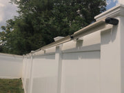Oscillot installation on vinyl fence